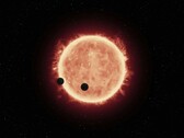 Un'illustrazione che mostra una stella e due pianeti.