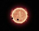Un'illustrazione che mostra una stella e due pianeti.