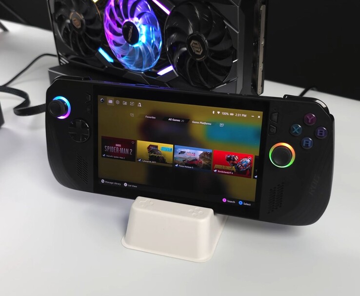 Il palmare Asus ROG Ally X collegato a una AMD Radeon RX 9070 XT in un dock esterno Oculink eGPU, mostra sul suo schermo giochi come Spider-Man 2, Cyberpunk 2077, Forza Horizon 5 e Borderlands 4 (Fonte immagine: ETA PRIME via YouTube)