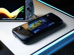 Uno Steam Deck che visualizza la schermata iniziale di SteamOS si trova su una scrivania bianca luminosa accanto a vari PC portatili da gioco basati su Windows, tra cui i dispositivi ASUS ROG Ally e Ayaneo. (Fonte: Notebookcheck)