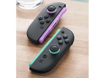 I nuovi Joy-Con hanno accenti viola chiaro e verde chiaro sulle guide e sui joystick. (Fonte: Nintendo)