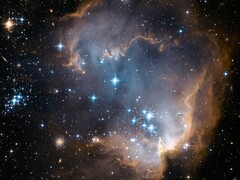 Immagine Hubble di una regione di formazione stellare nella Piccola Nube di Magellano ( NASA Hubble Space Telescope via Unsplash; ritagliata)