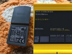 Un cartello di test di sviluppo contenente i dati della classifica per Pokémon Tsuri Taikai