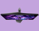 L’immagine mostra il monitor da gaming AOC AG276UZ su uno sfondo viola. Il monitor da gaming presenta un design decisamente orientato al gaming, completo di illuminazione RGB sul retro.