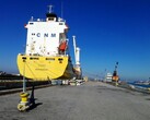 Una nave container ormeggiata in una banchina (Fonte: Bruno Hervas via Unsplash)
