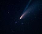 Un'immagine che mostra una cometa e la sua coda.
