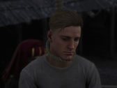 Uno screenshot che mostra Sir Hans Capon mentre viene impiccato in Kingdom Come Deliverance 2