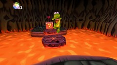 La schermata di Croc Legend of the Gobbos mostra Croc che salta sulla lava