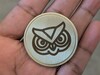 Design SVG stock su moneta di ottone con laser a fibra.