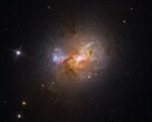 Un'immagine che mostra la galassia nana a esplosione stellare Henize 2-10.