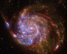 Un'immagine che mostra una galassia a spirale.