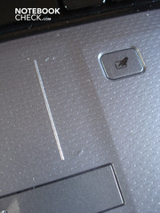 The touchpad possesses its own vertical scroll bar and a button for deactivation