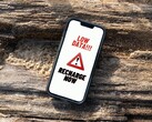 schermata dell'iPhone che mostra un messaggio persistente di avviso di ricarica dati insufficiente. (Fonte immagine: Arpit Brandings via Pexels, modificato)